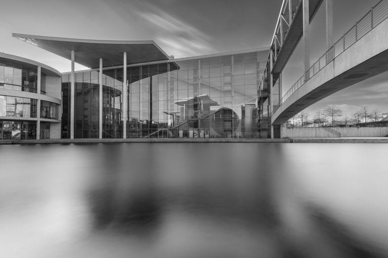 Berlin's Bundestag with reflection of the Paul-Löbe house in black and white